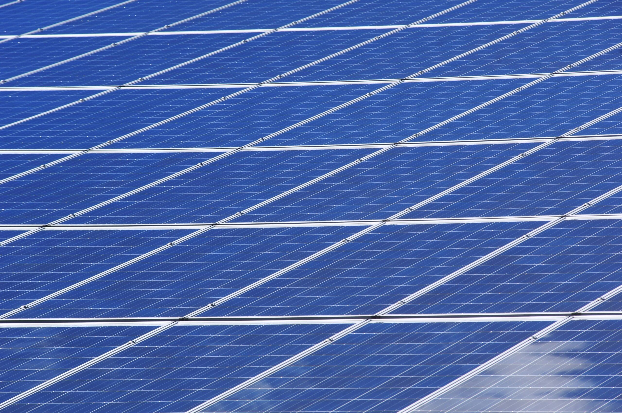 Home Close-up view of solar panels outdoors capturing renewable energy efficiently.